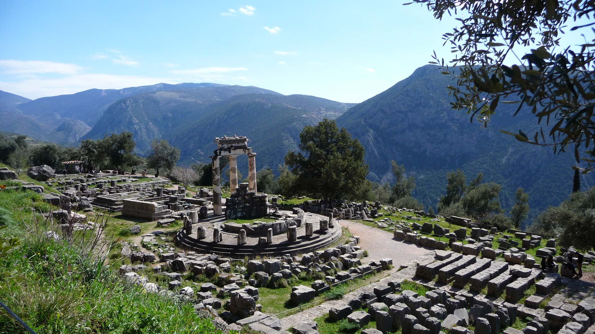 The Sanctuary of Athena Delphi, Greece - The Delphi Symposium seeks io respond to current global challenges by bringing together leading thinkers and explorers across  multi-disciplinary fields of religion, spirituality, psychology, and humanities in order to create a unifying  vision inspiring hope and collective action.